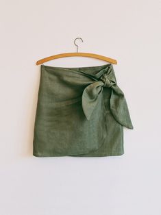 a green skirt hanging on a hanger with the words sewing pattern sew - along video