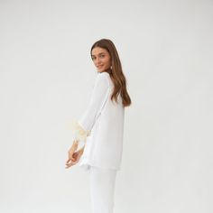 Elegant Lounging Sets With Long Pants, White Long Pants Sets For Daywear, Chic White Loungewear Sets, Elegant Relaxed Fit Tops For Pajama Party, Chic White Relaxed Fit Sets, Chic White Sleepwear For Loungewear, Elegant White Sleepwear For Loungewear, Elegant White Sleepwear, Chic White Sleepwear For Lounging