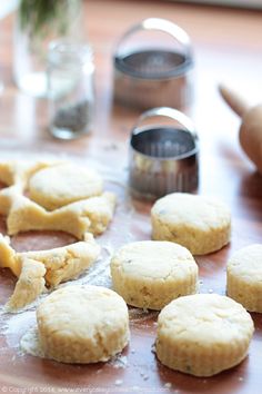 some cookies are sitting on a table and ready to be baked