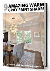 the front cover of an amazing warm gray paint shade book, featuring a dining room table and chairs