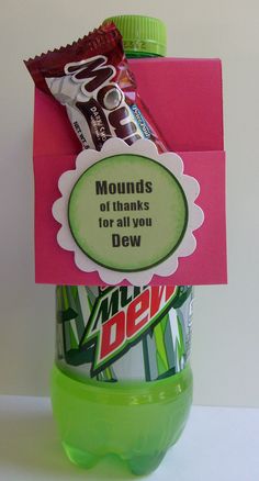 there is a bottle with candy in it and a note attached to the top that says, mounds of thanks for all you dew