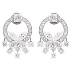 Add a touch of timeless elegance to your jewelry collection with these exquisite Wedding Diamond Earrings. Handcrafted with meticulous attention to detail, these stunning earrings are sure to capture hearts and turn heads wherever you go. These are perfect Gift for Mom, Fiancée, Daughter, Girlfriend, Wife and Grandmother. It can be worn on any occasion. Best Gift for Valentine’s Day, Mother’s Day, Easter, Christmas, New Year, Birthdays or any other special day. Say it with a diamond! Features: ✦ Luxury White Gold Diamond Crystal Earrings, Luxury Carved White Jewelry, Diamond Chandelier Earrings With Brilliant Cut For Anniversary, Anniversary Diamond Chandelier Earrings With Brilliant Cut, Luxury Platinum Cluster Earrings In Diamond White, Luxury Diamond White Platinum Cluster Earrings, Timeless Evening Bridal Earrings With Cubic Zirconia, Evening Bridal Earrings With Brilliant Cut In White, Elegant Diamond Cluster Earrings Gia Certified