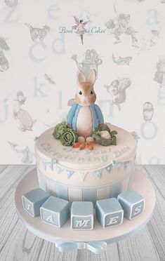 a cake with a rabbit figurine sitting on top of it