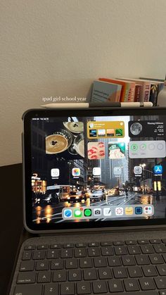 an open laptop computer sitting on top of a table