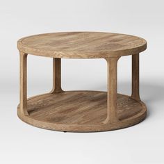 a round wooden table with two legs