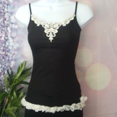 Net. Gorgeous Black Ribbed Lace Flower Tank Top Brand New Never Been Worn! Tight Fit. Very Form-Fitting. Beautiful Lace Detail On Bottom And Embroidery On Top. Fitted White Tank Top With Floral Embroidery, White Fitted Tank Top With Floral Embroidery, Fitted Lace Trim Camisole Top, Fitted Lace Camisole Casual Style, Casual Fitted Lace Camisole, Fitted Black Tank Top With Lace Detail, Fitted Black Lace Tank Top, Fitted Floral Embroidery Camisole For Summer, Fitted Floral Embroidered Camisole For Summer