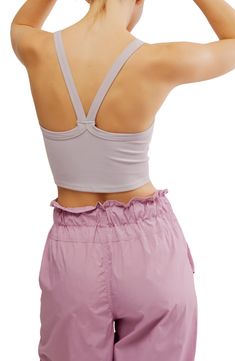 A cropped, racerback cut defines this rib camisole that's always ready for layering, lounging, lunging, lay-ups—you get the idea. 14" length (size Medium/Large) Scoop neck Racerback 87% polyamide, 13% elastane Dry clean or machine wash, dry flat By Free People; made in Turkey Seamless Racerback Crop Top For Loungewear, Spring Crop Top With Built-in Bra For Gym, Bra Friendly Racerback Crop Top For Loungewear, Spring Crop Top Sports Bra For Loungewear, Versatile Crop Top With Tank Straps For Spring, Spring Sports Crop Top With Built-in Bra, Sporty Camisole Crop Top For Yoga, Spring Cami Sports Bra With Seamless Construction, Spring Racerback Crop Top For Loungewear