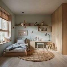 a bedroom with a bed, desk and shelves on the wall next to a window