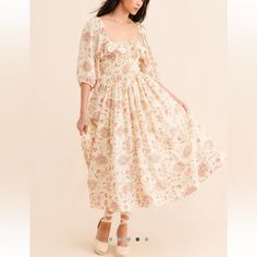 Free People Oasis Printed Ruffle Floral Gauzy Cottagecore Coquette Midi Dress Printed To Perfection, This Effortlessly Ethereal Midi Dress Is Featured In A Ruffle-Adorned Design With Smocking At Waist And Exaggerated Sleeves For Added Shape. Fit: Flowy, Relaxed Fitfeatures: Square Neckline, Smocking At Bodice, Side Pockets, Pleating Throughout, Fully Lined Skirtwhy We <3 It: The Perfect Pick For Any Occasion, This Darling Midi Was Designed To Be Dressed Up Or Down. Nwt Size: M Color: Ivory Combo Cottagecore Ruffled Dresses For Brunch, Feminine Spring Prairie Dress For Daywear, Cottagecore Midi Dress With Ruffles, White Dress With Gathered Neckline For Garden Party, Feminine Floral Print Prairie Dress For Daywear, Feminine Prairie Dress With Floral Print For Daywear, Cream Feminine Dress With Smocked Bodice, White Feminine Prairie Dress For Garden Party, Feminine Cream Dress With Smocked Bodice