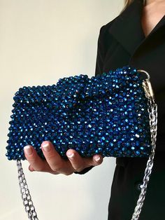 This handmade blue bag will complete your look. Made with blue crystal beads. The bag has a blue lining and silver fittings, comes with silver chain 1.1 m. Bag dimensions: -Height - 12 cm -Width-20 cm, -Depth 6 cm This model can FITS: - Iphone - car keys - headphones - cardholder - lipstick - antiseptic The bag is very durable. It is ideal for any occasion and for those who love handmade accessories. Blue Rhinestone Evening Bag For Party, Blue Rhinestone Clutch Bag, Blue Rhinestone Clutch For Party, Blue Handmade Evening Bag For Everyday Use, Blue Beaded Clutch For Gift, Blue Beaded Shoulder Bag As Fashion Accessory, Blue Embellished Rectangular Clutch, Blue Evening Clutch With Rhinestones, Blue Shoulder Evening Bag For Gift