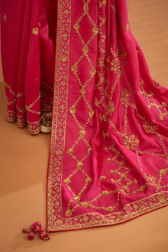 Editor's Note A fuschia pink zardozi embroidered dupion silk sari and blouse would be a stunning and bold choice for a formal occasion. The rich and luxurious fabric of the dupion silk would dr... Blouse Sari, Zardozi Work, Zardozi Embroidery, Dupion Silk, Sari Blouse, Silk Sari, Work Sarees, Blouse For Women, Luxurious Fabric