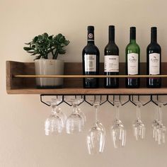 several wine glasses are lined up on a shelf