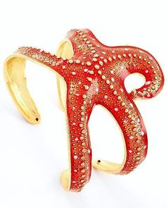 Here is a Very  Comfortable  Adjustable Starfish  Cuff  Bangle Bracelet  Coral Red  and Gold Tone .This Bracelet will  comfortably fit any size wrist  . It looks great and  goes with any outfit . The Size of starfish is about 2 1/5 inches.     This bracelet comes in a Gift Box perfect for Gift Giving. I ship by Expedited mail  ( delivery 3-5 days).   Thank You for looking !