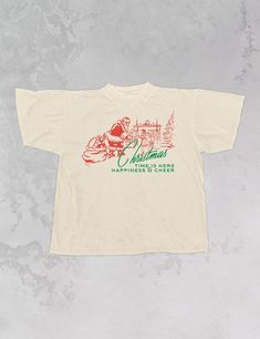 Celebrate that Christmas time is here in our super cozy oversized t-shirt, just in time for the Holiday season!- Features Santa by a Christmas tree giving a child presents with the phrase "Christmas Time is here, Happiness & Cheer" underneath it all in a green and red ink- Screen print transfer that is individually heat pressed onto each tshirt- Printed on a vintage wash, super soft t-shirt that gets softer with each wash- 100% Cotton- Oversized fit- Sizing translation: XS/S - L , S/M - XL , L/XL - 2XL , 2XL/3XL - 3XL**due to screens & filters color may vary from pictures** Christmas Tshirt Vinyl, Retro Christmas Shirts, Adpi Merch, Screen Print Transfer, Santa Shirt, Starbucks Christmas, Print Transfer, Christmas Time Is Here, Santa Shirts