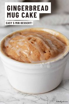 gingerbread mug cake in a white bowl on a marble table with the words easy 5 min dessert