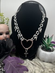 Handmade Chain Mail Necklace featuring a heart centerpiece with cross and spikes!  ꘎ 𝔸𝕓𝕠𝕦𝕥 ❥ Makes the perfect gift! ❥ Made of Aluminum Rings ❥ Adjustable Length at back, let me know if you want an extension! ꘎꘎ 𝕊𝕙𝕚𝕡𝕡𝕚𝕟𝕘 ❥Can take up to 7 days or more to ship out! Punk Heart Charm Necklace For Valentine's Day, Punk Style Heart Charm Necklace For Valentine's Day, Gothic Necklace With Adjustable Chain For Valentine's Day, Gothic Heart Jewelry With Adjustable Chain, Gothic Heart-shaped Jewelry With Adjustable Chain, Punk Style Heart Necklace For Valentine's Day, Emo Heart-shaped Jewelry For Valentine's Day, Punk Metal Heart Necklace For Valentine's Day, Punk Style Metal Heart Necklace For Valentine's Day