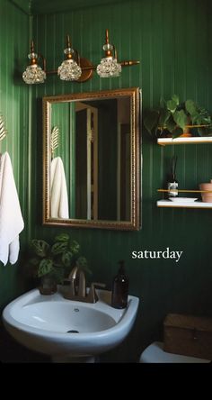 a bathroom with green walls and white sink