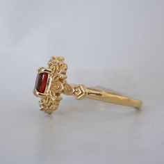 Read about our payment plans before proceeding. In the heart of this exquisite Faith ring, a crimson spinel nestles, a gem of nature's tender artistry. Embraced by delicate scroll-like motifs, each curve whispers tales of timeless elegance, bestowing upon it a vintage flair that dances with the echoes of ages past. Crafted by skilled hands, this ring is available in your choice of 14K and 18K yellow gold, rose gold, and white gold. All orders come in our Tippy Taste ring box. This ring is handmade and designed in NYC. 14K or 18K solid gold Natural red spinel, 6*4mm Natural round diamonds. SI clarity, GH color, 0.02ct total carat weight 1.5mm ring band ** Tippy Taste Heirloom Collection is made to order. Please allow 3-4 week turnaround time. Shipping:Domestic: Free shippingInternational: F Elegant Garnet Ruby Ring Stamped 14k, Heirloom Yellow Gold Garnet Jewelry, Heirloom Gold Garnet Rings, Handmade 14k Gold Elegant Ruby Ring, Handmade Elegant Ruby Ring In 14k Gold, Handmade Elegant 14k Gold Ruby Ring, Heirloom Gold Cluster Ring With Garnet, Elegant Handmade Gold Ruby Ring, Heirloom Garnet Cluster Ring With Gemstones