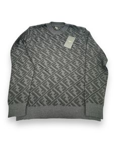 FF monogram-pattern jumper Sold Out in stores Description dark grey virgin wool blend FF motif monogram pattern logo patch to the side crew neck long sleeves straight hem ribbed trim Brand Style ID: FZX005ALJX SIZE & FIT Fitting Information • This piece fits true to size. We recommend you get your regular size • Cut for a relaxed fit - Made with a mid-weight fabric Elevate your wardrobe with this stylish FENDI FF Monogram allover men's pullover sweater. Made in Italy, this sweater features a crew neck and a relaxed fit, perfect for any occasion. The black color and geometric pattern make it a versatile piece that can be paired with any outfit. Crafted from a blend of viscose and wool, this knit sweater is dry clean only, ensuring its quality. The FF character adds a touch of luxury to this Ff Character, Luxury Men's Sweater With Logo Print, Luxury Men's Sweater With Logo Detail, Fendi Shirts Men, Fendi Womens Sweater, Ff Monogram, Fendi Sweater, Mens Pullover Sweater, Pattern Logo