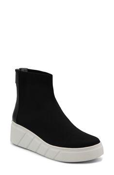 A well-cushioned footbed and stretchy knit upper bring lasting comfort to this fashion-forward sneaker kicked up on a textured platform wedge. 2" heel; 1" platform Back zip closure Cushioned footbed with arch support Textile upper/synthetic lining/rubber sole Imported Black Synthetic Wedge Sneakers With Thick Bottom, Modern Wedge Heel Platform Sneakers, Trendy Synthetic Wedge Sneakers With Lug Sole, Modern Wedge Sneakers With Lug Sole, High-top Synthetic Wedge Sneakers With Thick Bottom, Modern Platform Sneakers With Wedge Heel, Ankle-high Synthetic Platform Sneakers With Cushioned Footbed, High-top Synthetic Wedge Sneakers, Ankle-high Cushioned Platform Sneakers