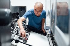 a man working on an assembly line in a factory