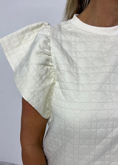 Alexander Quilted Top Chic Crew Neck Short Sleeve Top For Day Out, Chic Short Sleeve Crew Neck Top For Day Out, White Flutter Sleeve Trendy Top, Chic Beige Blouse With Crew Neck, Chic Beige Crew Neck Blouse, Beige Short Sleeve Blouse For Loungewear, Beige Ruffled Top With Flutter Sleeves, Beige Ruffled Flutter Sleeve Top, Chic Beige Top With Flutter Sleeves