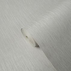 a roll of white fabric on top of a table