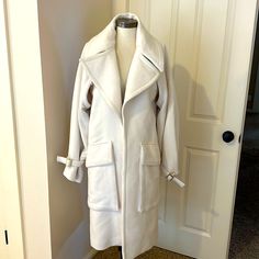 Beautiful Gucci Wool Cream Coat. Large Fashion Lapels. Very Warm And Thick. Beautiful Accent, Including Gold Hardware Branded With Gucci Accents And Front Pockets. Perfect For Winter. New Without Tags. However, One Small Moth Hole Noted In Pictures On Left Shoulder. Can’t See When Wearing Due To The Lapel Covering It. Size: 42 (Italy) Size: 6 (Usa) Shoulder To Shoulder - 19” Collar To Hem - 43” Shoulder To Sleeve - 26” Luxury Gucci Cream Outerwear, Luxury Cream Gucci Outerwear, Gucci Cream Winter Outerwear, Beige Gucci Outerwear For Winter, Chic Gucci Long Sleeve Outerwear, Elegant Cream Gucci Outerwear, Chic Long Sleeve Gucci Outerwear, Gucci Beige Outerwear For Fall, Chic Gucci Winter Outerwear