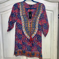 Brand New With Tag From Tolani. Bought At Revolve Clothing. Silk Boho Style Dress With Mandala On Back. Xs. Style Is Madison. Vibrant Print V-neck Tunic, Purple Tunic Dress For Beach Cover-up, Bohemian Multicolor V-neck Tunic, Printed V-neck Festival Tunic, Purple Floral Print Tunic Dress, Festival V-neck Printed Tunic, Purple Boho Print Dress For Festivals, Printed V-neck Tunic For Festival, Bohemian Purple Tunic Dress