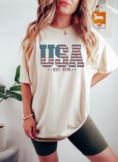 Retro USA Est 1776 Shirt, America 4th of July T-Shirt, USA Flag Shirt, Stars and Stripes Tee, American Women Shirt HOW TO ORDER: - Review all colors available and size chart - Select your T-Shirt size, type, and color from the drop-down menus - Head to checkout when you are ready and complete the information needed. SELECT Your T-Shirt Style, Size and text design from drop down menus. -Choose Your Quantity as much as you want. -You will see "Add Your Personalization" Section which is located bel Diy Usa Shirt, Usa Shirt Ideas, American Casual, Usa Shirt, Patriotic Shirts, Comfort Colors Tee, Flag Shirt, Selling Clothes, Women Shirt