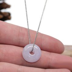 Design Concept--- The simple shape of a circle represents things such as happiness, wholeness, and prosperity. Also known as the "Circle of Heaven". This necklace is made with very high-quality genuine lavender jadeite jade from Burma. Which produces some of the finest in the world. Refined, exquisite. Very very slightly included. Gifting one of these is like wishing the best luck upon your family or loved ones. It's a perfect gift. Jade represents good luck, wealth, and safety. Total weight: 7. Minimalist Round Jewelry For Meditation, Handmade Lavender Round Necklace, Purple Round Jade Jewelry, Lavender Gemstone Round Necklace, Adjustable Round Lavender Jewelry, Adjustable Lavender Round Jewelry, Adjustable Lavender Jewelry, Purple Round Minimalist Jewelry, Minimalist Purple Round Jewelry