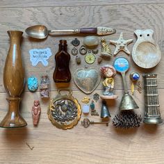 there are many different items on the table including spoons, bottles and other things