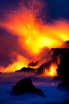 an image of a volcano that is in the sky with fire coming out of it