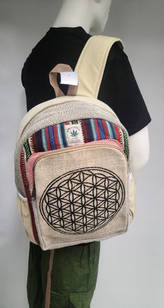 Himalayan Hemp Flower of Life Backpack Its Made from Hand -Woven Pure Himalayan Hemp and Cotton fabric, by people of Himalaya (NEPAL) Perfect for everyday use, special occasion and for your school /collage. it has soft padded adjustable shoulder strap come with one main compartment with double zipper, place for mini laptop and tablet, outside one zipper pocket and water bottle holder on both side of Backpack. its a very handy and multi purpose backpack come in 2 different size. *LARGE* Length - Eco-friendly Multicolor School Backpack, School Collage, Hippie Backpack, Mini Laptop, Water Bottle Holder, Water Bottle Holders, Granola Girl, Bottle Holder, Flower Of Life