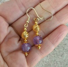 These earrings are made with rich, purple amethyst stone and gold plated filigree findings. Drops are 12mm long, and hang from fish hook earwires. Earrings are handmade to order. Gift wrap is available! Gold Amethyst Earrings With Ear Wire, Handmade Amethyst Gold Earrings, Handmade Gold Amethyst Earrings, Pride Necklace, Sterling Silver Dangle Earrings, Silver Chain Necklace, Drop Necklace, Amethyst Stone, Silver Earrings Dangle