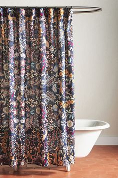 a bathroom with a bathtub and shower curtain