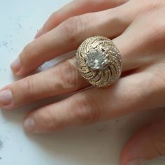 a woman's hand with a ring on it