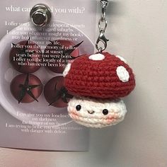 a crocheted keychain with a mushroom on it