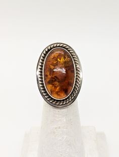 Sterling Desert Rose Trading Amber Ring - Sterling Jay King Large Oval Amber Ring - Wide 925 Amber Ring - Southwestern Amber Ring Size 5. This ring is Sterling Silver and has a wide Sterling band & setting with a gorgeous large oval Amber stone. Ring measures size 31mm x 22mm with a 14mm band at it's widest. Hallmarked and tested sterling with DTR maker's mark. Very good condition. This is one not to miss! Great Gift for Her! FREE DOMESTIC SHIPPING! VISIT OUR NEW Etsy Shop Sections For Handc Cameo Ring, Amber Ring, Loose Stones, Amber Stone, Desert Rose, Maker's Mark, Vintage Modern, Stone Ring, Sterling Ring