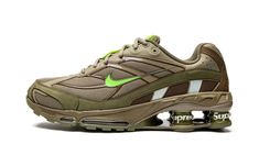 The Supreme x Nike Shox Ride 2 “Neutral Olive” is one of multiple colorways of the retro performance running shoe co-designed by the “World Famous” streetwear brand its Spring/Summer 2022 collection.  The Nike Shox Ride 2 originally debuted back in 2004 before returning in several new colors for Supreme’s 2022 collaboration.  This colorway features a tan mesh upper with overlays designed in olive green and brown leather and nubuck.  In true Supreme fashion, the brand places its signature brandin Mens Nike Shox, Supreme Shoes, Electric Green, Green Sneakers, Latest Shoe Trends, Streetwear Sneakers, Nike Shox, Stadium Goods, Unique Shoes