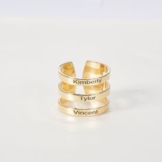 Celebrate the special people in your life with our Personalized Multiple Name Ring. This elegant, 14K gold plated ring is designed to hold up to 4 names, making it a perfect keepsake for loved ones. Crafted with precision and care, this custom square engraved ring is both stylish and meaningful, ideal for any occasion. Key Features: *Material: 14K Gold Vermeil over sterling silver (925) *Design: Custom square shape with multiple name engravings *Personalization: Add up to 4 names or words of you Personalized Gold Stackable Open Rings, Gold Hypoallergenic Adjustable Engraved Ring, Adjustable Hypoallergenic Gold Engraved Ring, Hypoallergenic Engraved Gold Ring For Anniversary, Adjustable Gold Engraved Couple Rings, Gold Hypoallergenic Initial Ring For Anniversary, Adjustable Tarnish-resistant Engraved Ring For Anniversary, Hypoallergenic Yellow Gold Open Ring, Gold Initial Ring With Open Band For Anniversary