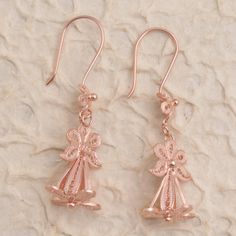 Refresh your look with this pair of unique dangle earrings from Bali's Yuniati. Crafted from 18k rose gold plated sterling silver filigree the earrings are designed with a floral motif and finished with oxidized details. Rose Gold Filigree Dangle Jewelry, Rose Gold Dangle Flower Earrings In Sterling Silver, Rose Gold Sterling Silver Dangle Flower Earrings, Rose Gold Flower Shaped Pierced Earrings, Rose Gold Flower-shaped Pierced Earrings, Rose Gold Flower-shaped Earrings With Ear Wire, Rose Gold Flower Shaped Earrings, Filigree Flower Earrings For Gift, Rose Gold Filigree Drop Earrings