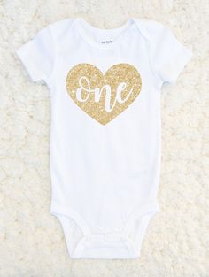 First Birthday Outfit Girl - First Birthday One Heart Shirt - Baby Girl Birthday One Piece - Birthday Girl Glitter 1st Birthday Tshirt EXCITING NEWS! ALL orders to the US are now sent via USPS and come with tracking Let everyone know your little girl is "ONE" in this super adorable heart glitter one piece bodysuit! Great for a cake smash/first birthday photoshoot! We can also customize number in the heart if your little one is celebrating a second, third, etc birthday (Size 2, 4 and 6 Tshirts av One Piece Birthday, First Birthday Onesie, One Piece Birthdays, 1st Birthday Onesie, Cake Smash First Birthday, First Birthday Photoshoot, Birthday Onesie, First Birthday Outfit Girl, First Birthday Shirt