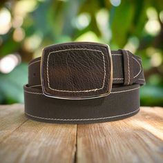 Make a bold statement with this genuine leather belt, a must-have for any wardrobe. Its  Western-inspired design will add versatility to your style, perfectly complementing your favorite blue jeans or boho dresses. Each piece is handmade for an authentic touch, and features a metal buckle and snap closure for easy removal. Elevate your fashion game with this timeless accessory. 🌻Width: 40 mm   🌻Buckle: Metal 🌻Cowhide leather belt.   Color: Dark brown JEANS SIZES ARE DIFFERENT FROM BELT SIZES Vestidos Boho, Belt For Jeans, Dresses Handmade, Handmade Leather Belt, Western Belt, Boho Dresses, Belt For Women, Brown Leather Belt, Brown Belt