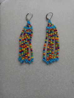 Multicolor fringe earringsmade with glass Czechoslovakian beads Rainbow Beaded Fringe Earrings For Gift, Rainbow Fringe Earrings As Gift, Multicolor Tassel Drop Earrings, Rainbow Tassel Earrings For Gifts, Rainbow Fringe Dangle Earrings, Rainbow Dangle Earrings With Fringe, Colorful Handmade Dangle Tassel Earrings, Multicolor Beaded Tassel Earrings As Gift, Rainbow Tassel Dangle Earrings