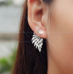 New, unique and pretty! A single crystal stud holds the intricately carved feather jacket. The feather peeks from behind the ear for an unexpected look. A little edgy a lot of sparkle. Materials: Gold or silver plating over alloy, and cz Comes gift boxed. (Reg $45.00) Silver Aesthetic, Droplet Earrings, Angel Wing Earrings, Luxury Earrings, Party Earrings, Wing Earrings, Trendy Earrings, Discount Offer, Flower Earrings Studs