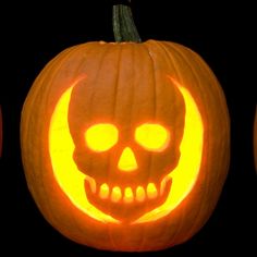 three pumpkins with carved faces on them