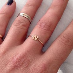 This unique initial letter cut-out is composed of 14K solid gold and beautifully complemented by a durable 14K solid gold band. Initial Letter Dimensions: approximately 5mm (w) x 5mm (h) Band Thickness: approximately 1.25mm Metal Finish: High Shine Polish This design is available in Rose, White and Yellow 14K Gold This item is proudly made in USA and also available in 18K solid gold options upon request. Kindly email info@nanabijoujewelry.com for further assistance with pricing and details. Plea Custom Alphabet, Gold Initial Ring, Simple Rings, Solid Gold Charms, Block Font, Charm Ring, Picture Letters, Usa Jewelry, Initial Name