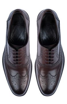 Handmade of smooth leather, this wingtip toe dress shoe with a classic oxford silhouette offers a sophisticated, elegant look. Leather upper and lining/synthetic sole Made in Turkey Classic Wingtip Lace-up Shoes With Leather Lining, Elegant Goodyear Welted Wingtip Lace-up Shoes, Classic Wingtip Lace-up Shoes For Derby, Classic Fitted Oxford Lace-up Shoes, Elegant Goodyear Welted Lace-up Derby Shoes, Elegant Goodyear Welted Lace-up Derby, Formal Wingtip Oxford With Leather Sole, Wingtip Oxford With Leather Sole For Formal Occasions, Timeless Wingtip Dress Shoes For Galas