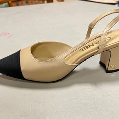 Beige Sling Back With Black Cap Toe. Softest Goat Skin Leather. Authentic Serial Number. See Pic. Feels Like Butter. A Beautiful Shoe For The Holidays. Brand New Never Worn. Come With Beautiful Dust Bag. Don’t Want To Miss These. Channel Sling Back Shoes, Chanel Slingback Shoes Two Tones, Chanel Classic Heels, Cap Toe Shoes, Black Cap, Sling Back, Chanel Black, Chanel Shoes, A Princess